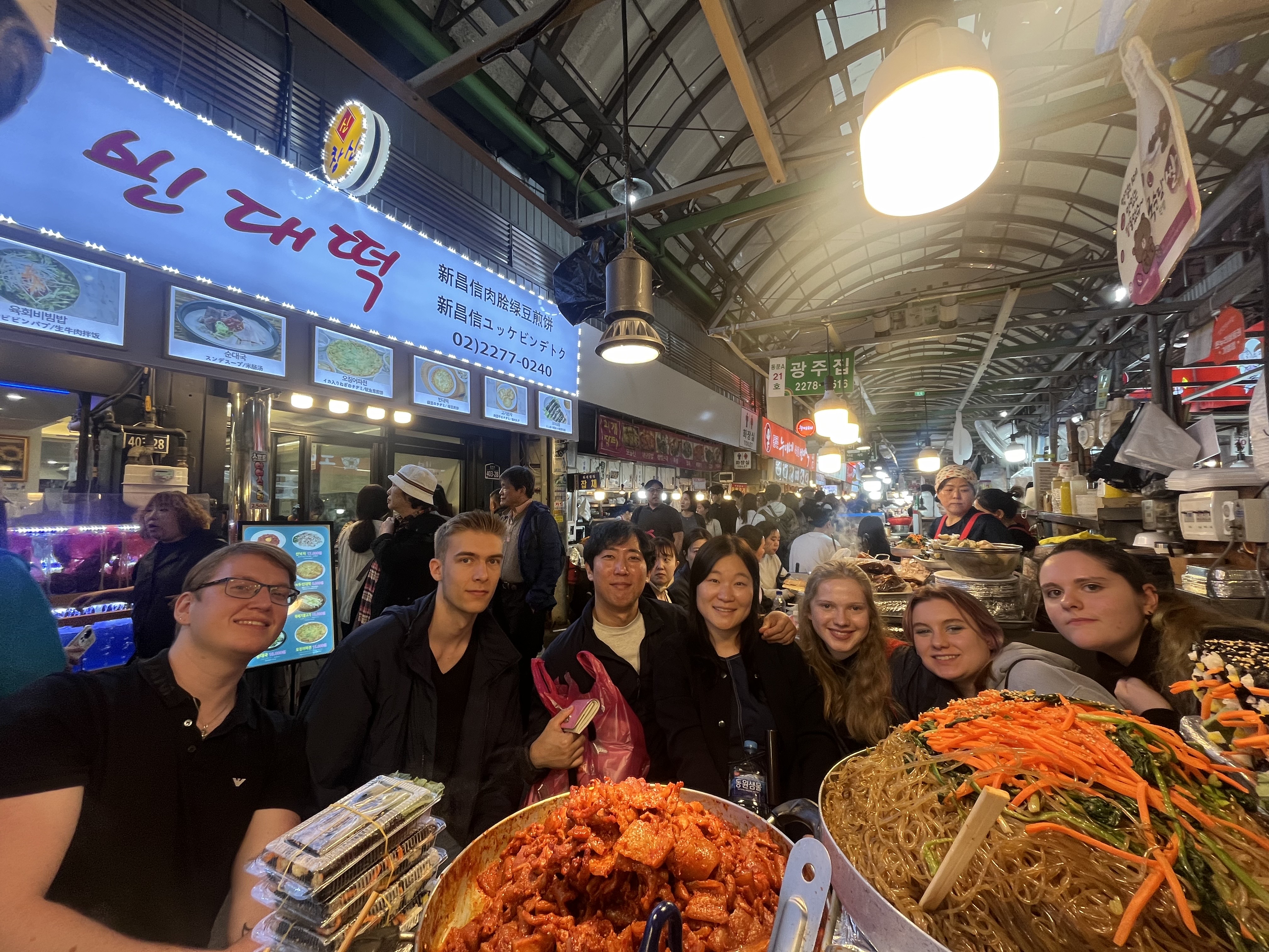 Eunjin and guests exploring a traditional Korean market